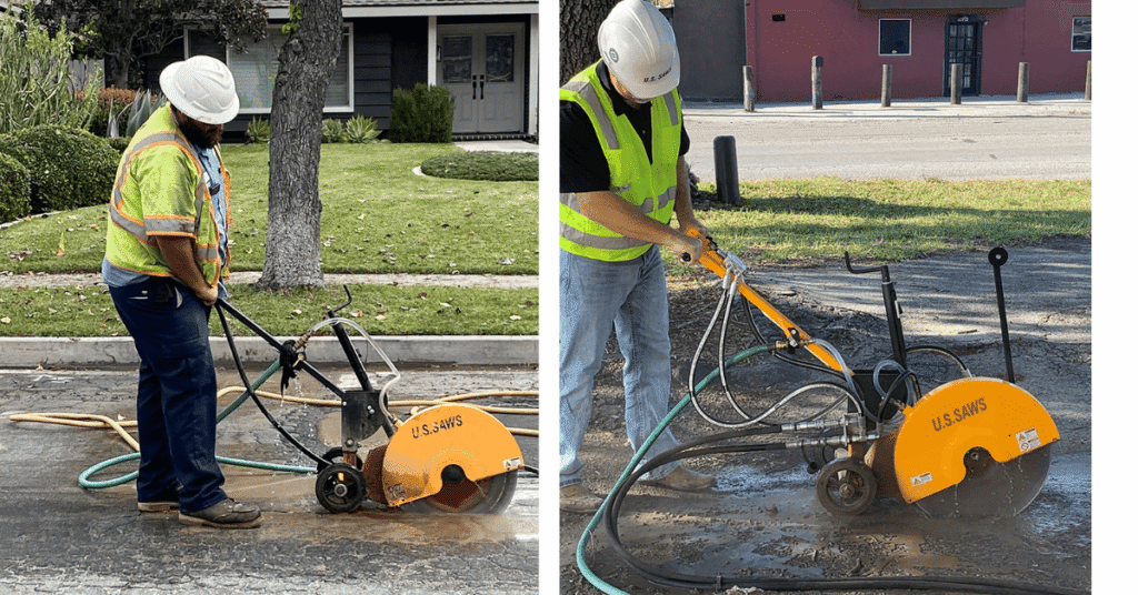 Two construction workers operate yellow U.S. Saws walk behind saw concrete cutting machines on a paved street, both wearing safety vests, hard hats, and using hoses to manage dust. r or Hydraulic Walk-Behind Saw